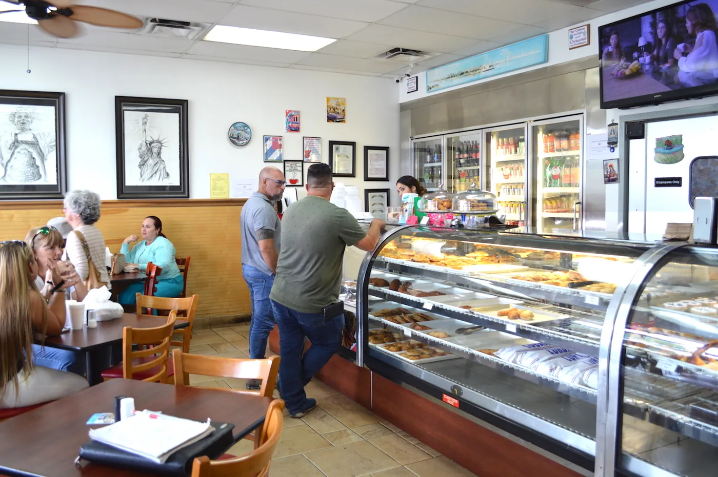 Customers at the bakery case